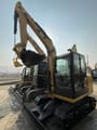 2024 Caterpillar 305.5E2 mini excavator, front three-quarter view
