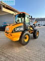 2011 JCB 409 wheel loader, rear three-quarter view