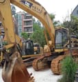 2011 Caterpillar 345BL crawler excavator, front three-quarter view
