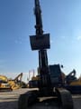 2024 Volvo EC380 crawler excavator, front view with raised boom