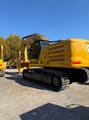 2025 Caterpillar 345 crawler excavator, rear three-quarter view