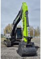 2026 Zoomlion ZE210GLC Crawler Excavator with a light grey body, featuring a large black digging bucket attached to the lime green arm.