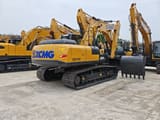 2026 XCMG XE215C Crawler Excavator showing the rear counterweight with the large XCMG logo and a black bucket.