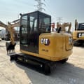2023 Caterpillar 305.5E mini excavator, rear three-quarter view