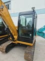 2022 Caterpillar 305.5E2 crawler excavator cab and boom view