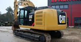 2012 Caterpillar 320E crawler excavator, rear three-quarter view