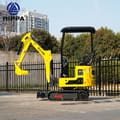 2026 Rippa R319 Mini Excavator side view, highlighting the yellow body and black undercarriage with red arrow decal.