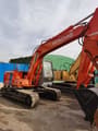 2014 Hitachi EX120-2 crawler excavator, rear three-quarter view