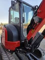 2021 Kubota U36-4 mini excavator, side view of cab and boom