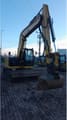 2021 Caterpillar 310-07 crawler excavator, front three-quarter view
