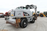 2009 Caterpillar M313D wheel excavator, rear three-quarter view