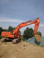 2022 Doosan DX225LC crawler excavator, side profile view
