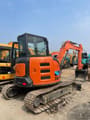 2025 Hitachi ZX55 mini excavator, rear three-quarter view