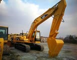 2023 Caterpillar 330BL crawler excavator, front three-quarter view