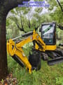 2024 Caterpillar 303.5E mini excavator, front three-quarter view