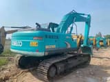 2021 Kobelco SK210D excavator, rear three-quarter view