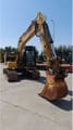 2021 Caterpillar 313-07GC crawler excavator, front three-quarter view