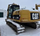 Escavatore cingolato Caterpillar 320D L del 2010, vista posteriore tre quarti