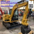 2024 Caterpillar 305.5E2 mini excavator, front three-quarter view