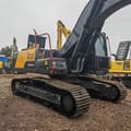 Volvo EC240 crawler excavator, rear three-quarter view