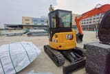 2023 Caterpillar 303.5E mini excavator, rear three-quarter view
