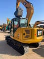 2024 Caterpillar 307.5 mini excavator, rear three-quarter view