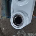 2026 Bobcat E19 Mini Excavator white boom arm, close-up of a pin connection point with visible bearing.