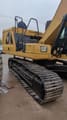 2021 Caterpillar 320GC crawler excavator side view