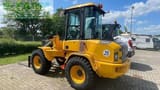 2023 Volvo L30 Mini Excavator with a clear view of the operator's cab and side panel details.