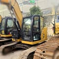 2019 Caterpillar 310 crawler excavator, side view of cab