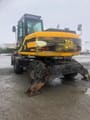 2001 JCB JS130W wheel excavator rear three-quarter view