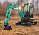 2024 Sunward SWE25UF Mini Excavator with an operator in the cab, showing the boom and bucket extended forward.