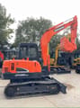 2022 Doosan DX55-9C mini excavator, side view