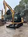 2021 Caterpillar 305.5E2 mini excavator, front three-quarter view