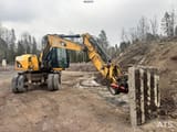 2011 Caterpillar M313D wheel excavator, side view