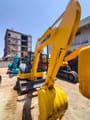 2018 Komatsu PC-55MR mini excavator, front three-quarter view