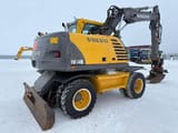 2004 Volvo EW140B wheel excavator, rear three-quarter view