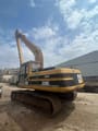 1998 Caterpillar 320BL crawler excavator, rear three-quarter view