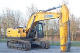 2023 XCMG XE300E Crawler Excavator with a yellow boom and arm positioned vertically, showing the hydraulic lines.