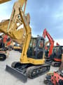 2024 Komatsu PC-55MR mini excavator, front three-quarter view