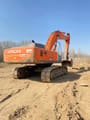 2022 Hitachi Zaxis 330 excavator, rear three-quarter view