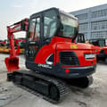 2024 Doosan DX60-9C mini excavator, front three-quarter view