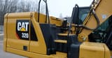 2019 Caterpillar 320 crawler excavator side view of cab and engine housing