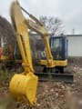 2015 Komatsu PC55MR-2 mini excavator, front three-quarter view