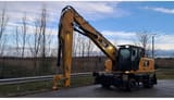 2020 Caterpillar MH3024-1 wheel excavator, front three-quarter view