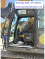 2026 XCMG XE135GA Crawler Excavator showing the operator station with a person seated inside the cab.