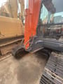 2018 Doosan DX60 crawler excavator, side view of cab and boom base