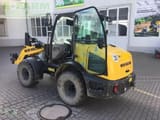 2021 New Holland W50C mini excavator, rear three-quarter view