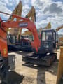 2018 Doosan DH55 mini excavator, front three-quarter view
