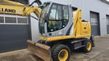 2011 New Holland WE150C wheel excavator, front three-quarter view